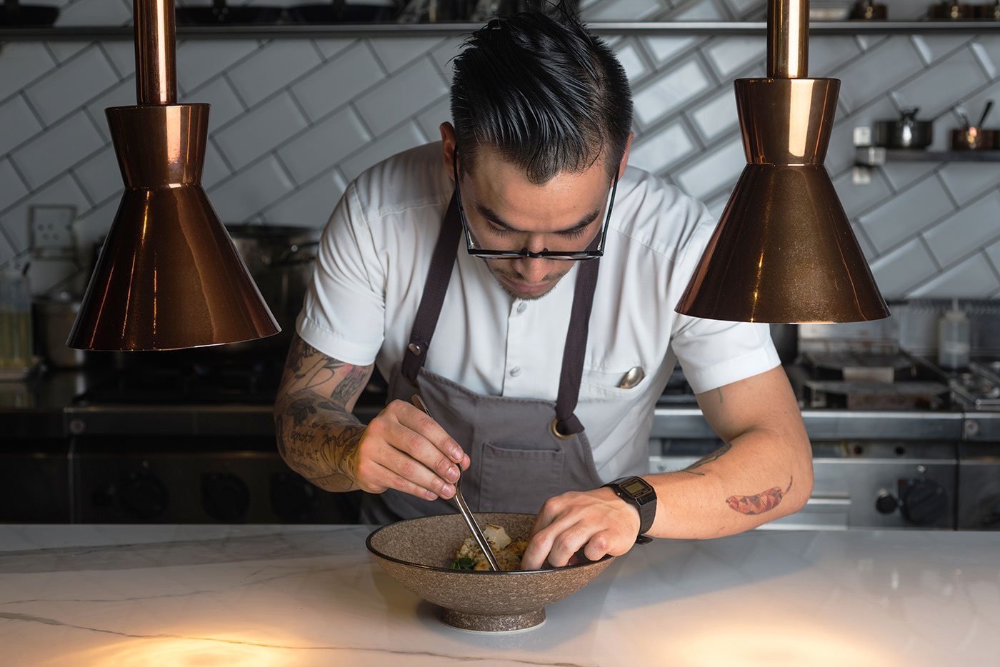 Sebastian from Andes chef plating a dish